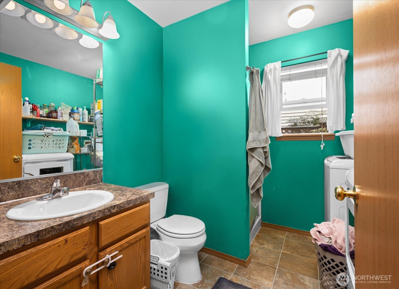 12808 East Macs Loop Road Granite Falls, WA 98252 - Photo 13 of 23 a bathroom with a sink a toilet and a mirror