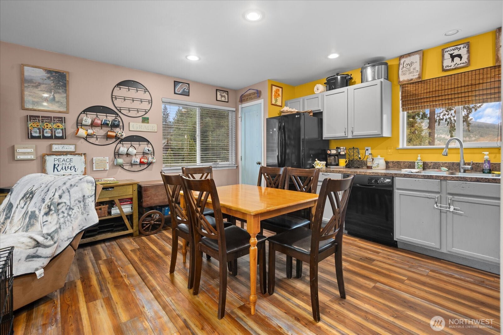 12808 East Macs Loop Road Granite Falls, WA 98252 - Photo 4 of 23 a view of a dining room with furniture window and wooden floor