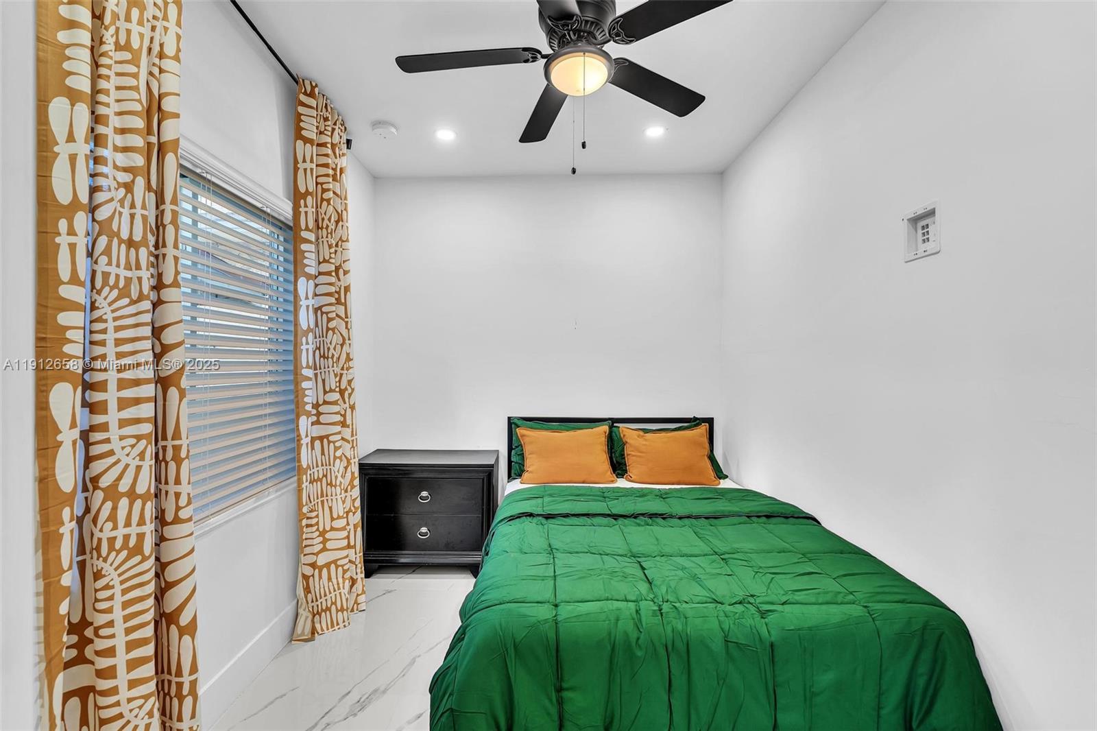 797 Northwest 35th Street Miami, FL 33127 - Photo 21 of 45 a front view of a house with a yard