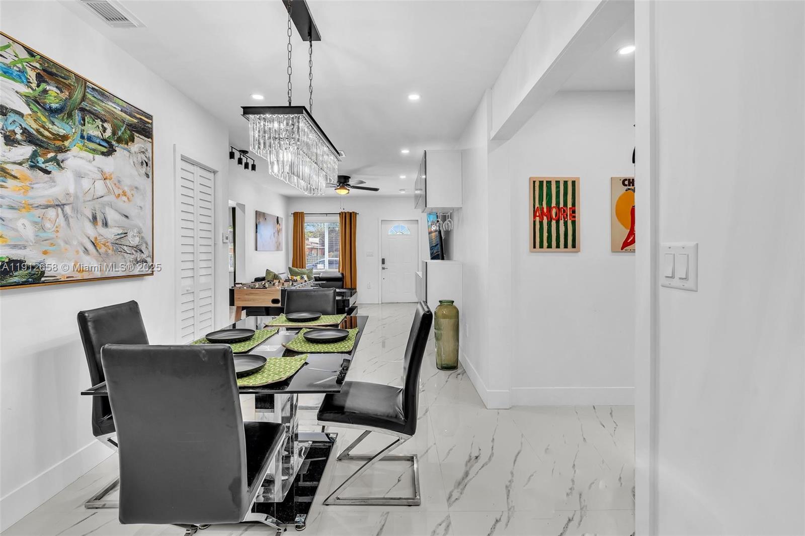 797 Northwest 35th Street Miami, FL 33127 - Photo 24 of 45 a view of a dining room with furniture a kitchen and a window