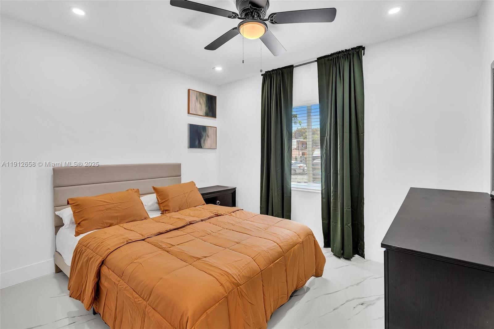 797 Northwest 35th Street Miami, FL 33127 - Photo 27 of 45 a bedroom with a bed and a window