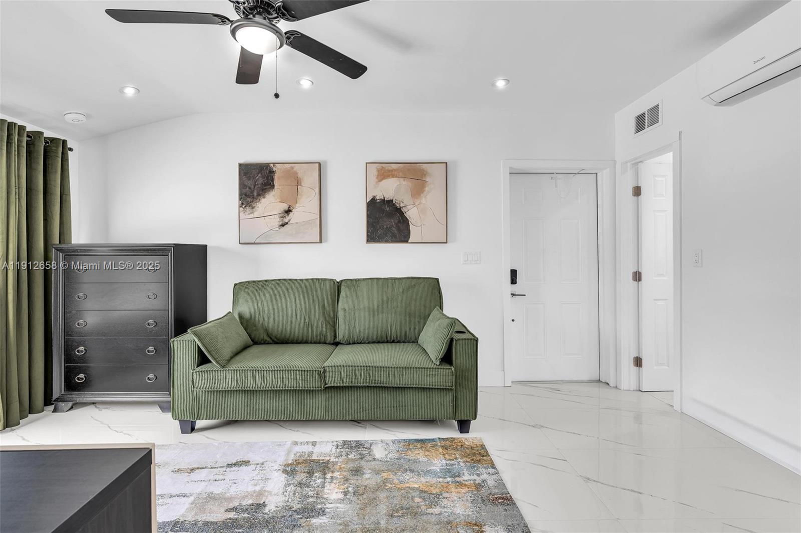 797 Northwest 35th Street Miami, FL 33127 - Photo 33 of 45 a living room with furniture and a ceiling fan