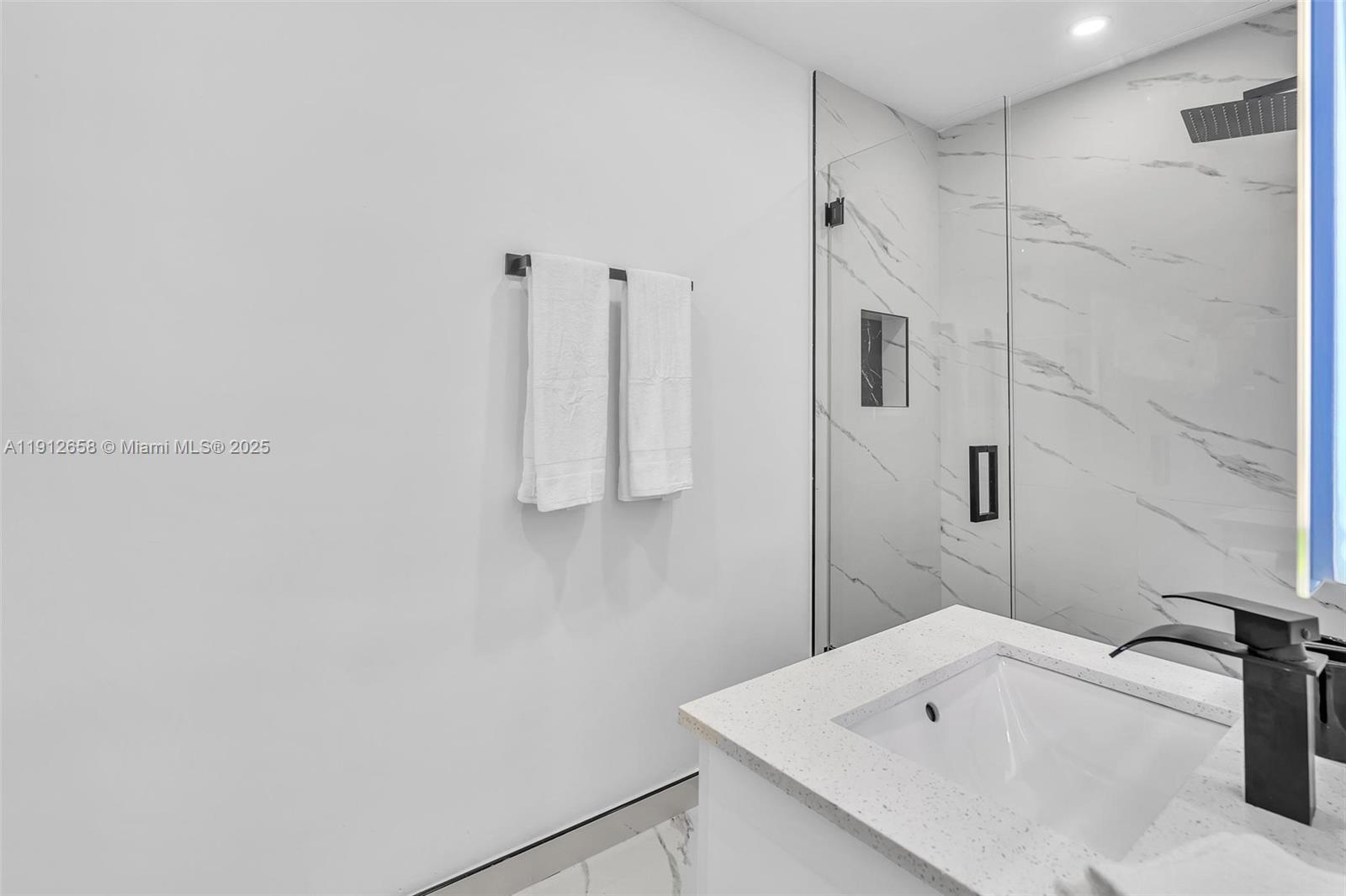 797 Northwest 35th Street Miami, FL 33127 - Photo 40 of 45 a bathroom with a sink and a tub