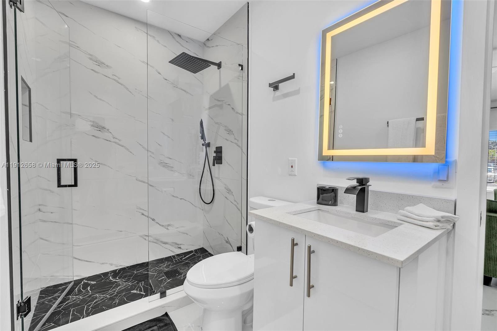 797 Northwest 35th Street Miami, FL 33127 - Photo 41 of 45 a bathroom with a sink toilet and shower