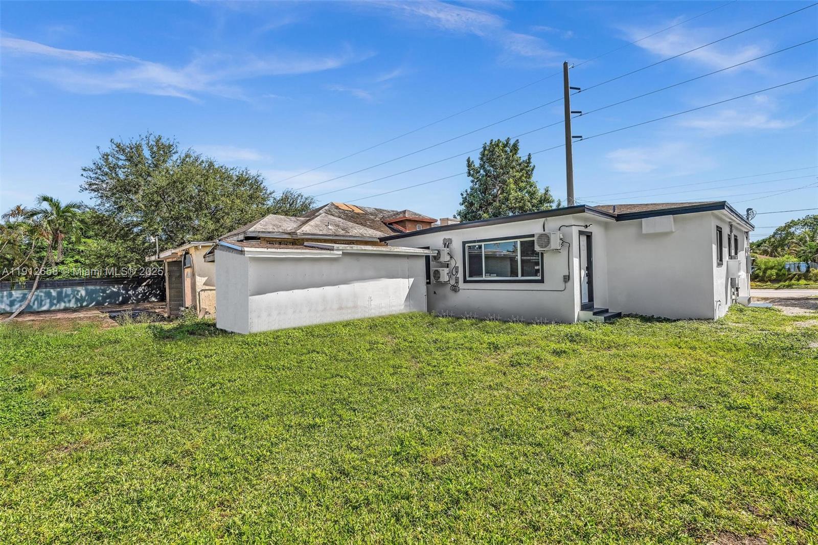 797 Northwest 35th Street Miami, FL 33127 - Photo 44 of 45 a house view with a garden space