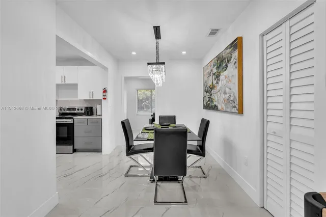 a dining room with furniture and window