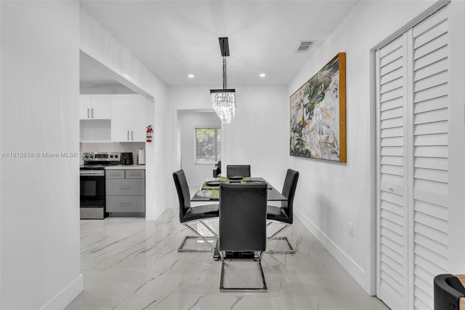 797 Northwest 35th Street Miami, FL 33127 - Photo 8 of 45 a dining room with furniture and window