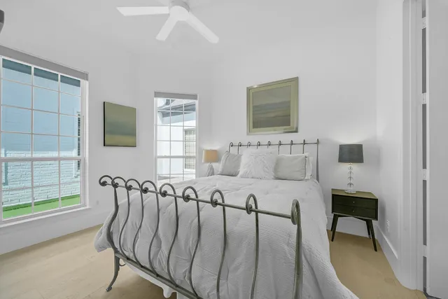 a bed room with furniture and a window