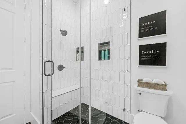 a bathroom with a shower and toilet