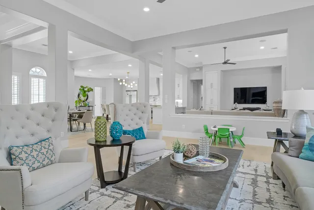 a living room with furniture and a potted plant