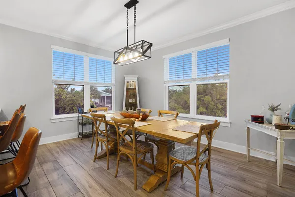 a view of a dining room with furniture window and outside view