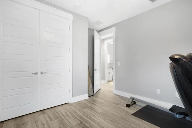 an empty room with a wooden door