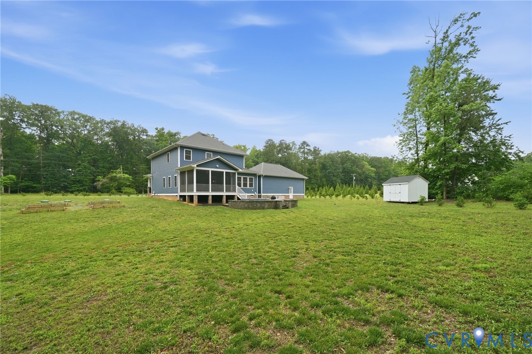 7598 Rural Point Road Mechanicsville, VA 23116 - Photo 35 of 41 a front view of a house with a garden
