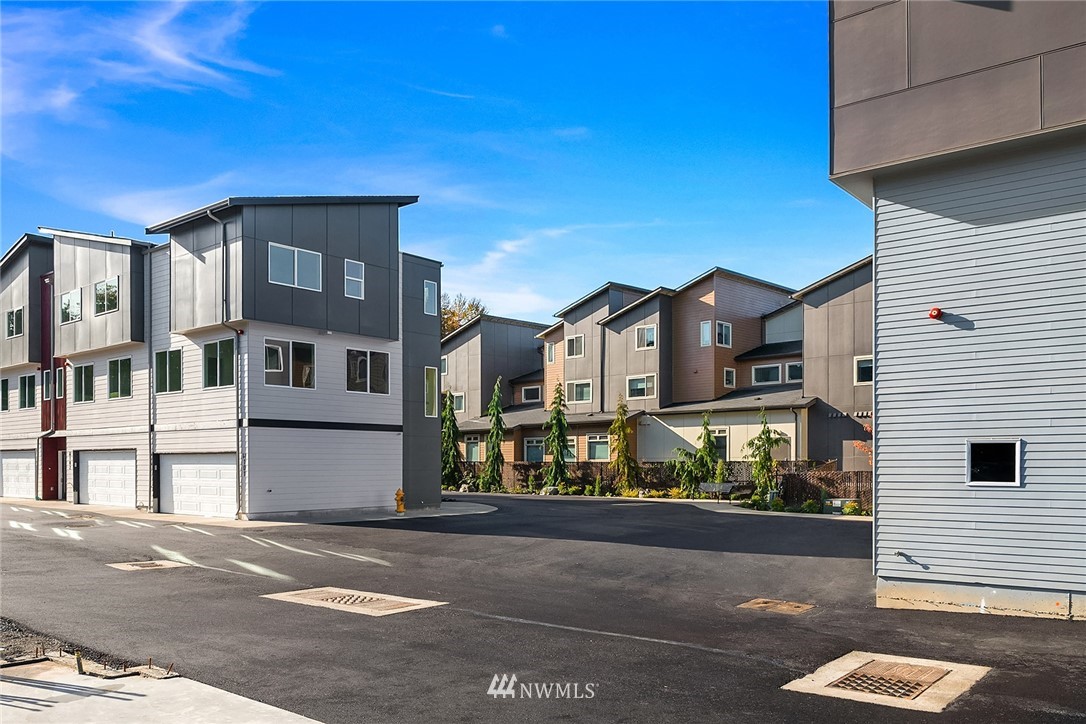 a front view of a house with a road