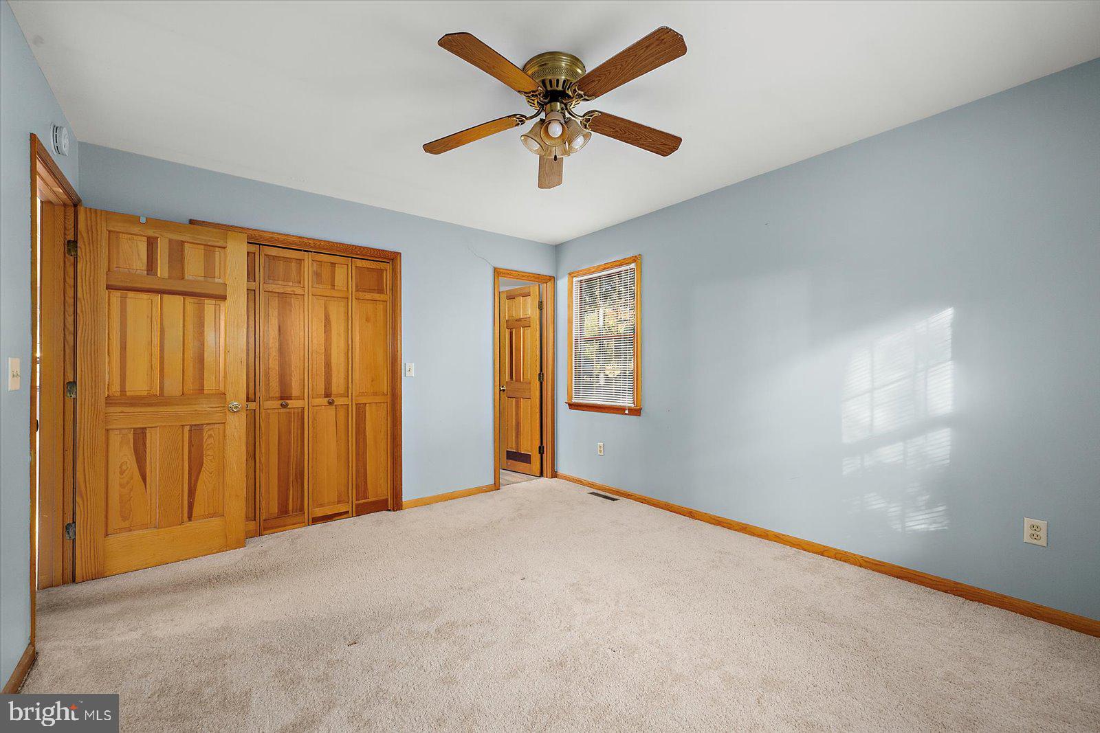 5079 Old Mill Branch Road Salisbury, MD 21801 - Photo 19 of 47 a view of an empty room with a window