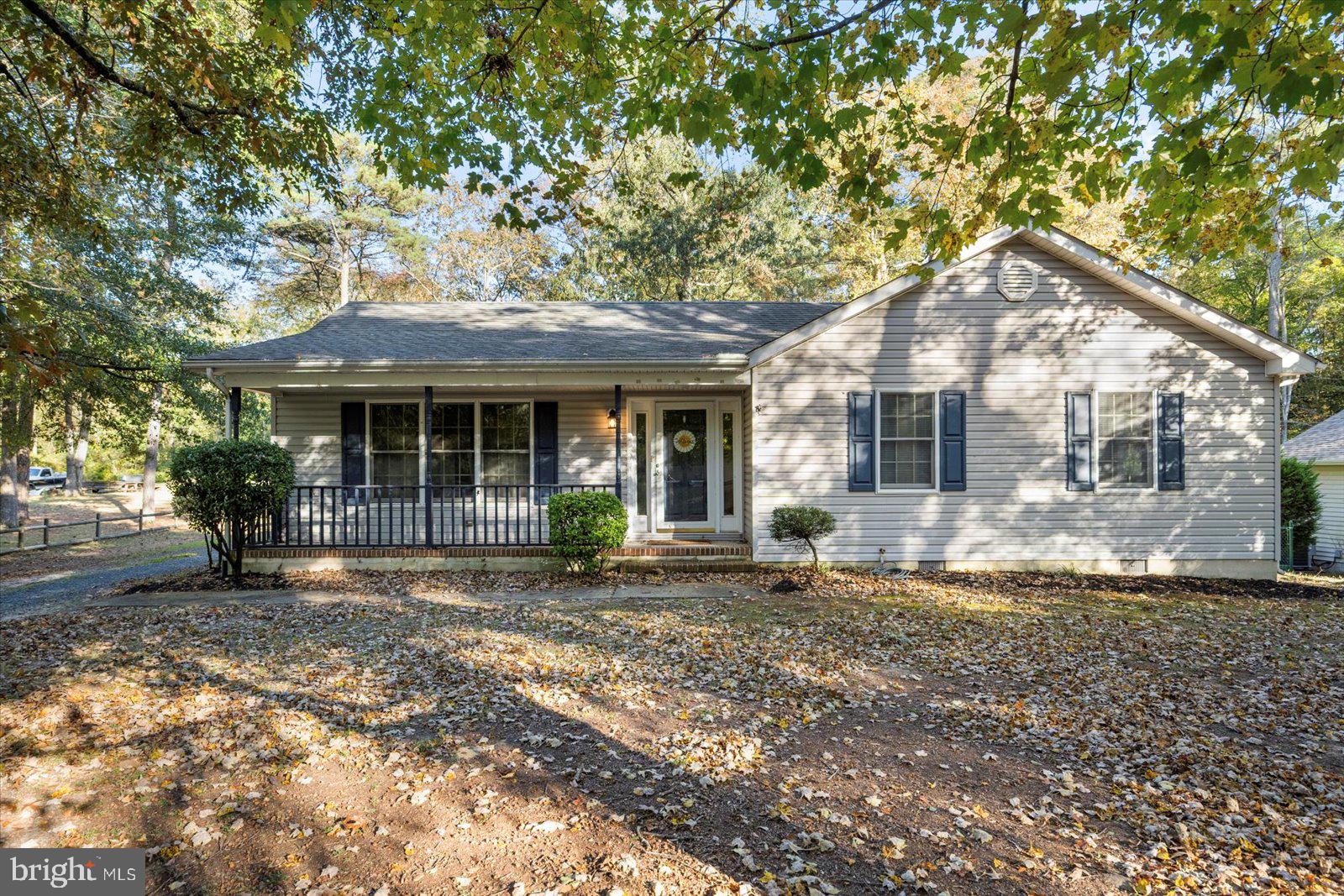 5079 Old Mill Branch Road Salisbury, MD 21801 - Photo 2 of 47 a front view of a house with a garden