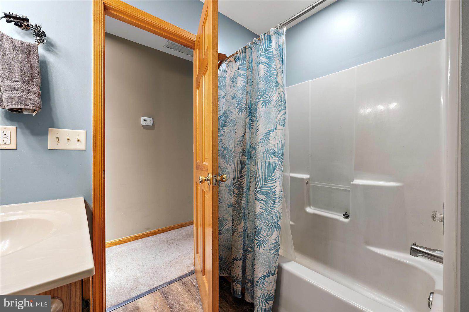 5079 Old Mill Branch Road Salisbury, MD 21801 - Photo 25 of 47 a bathroom with a shower and a tub