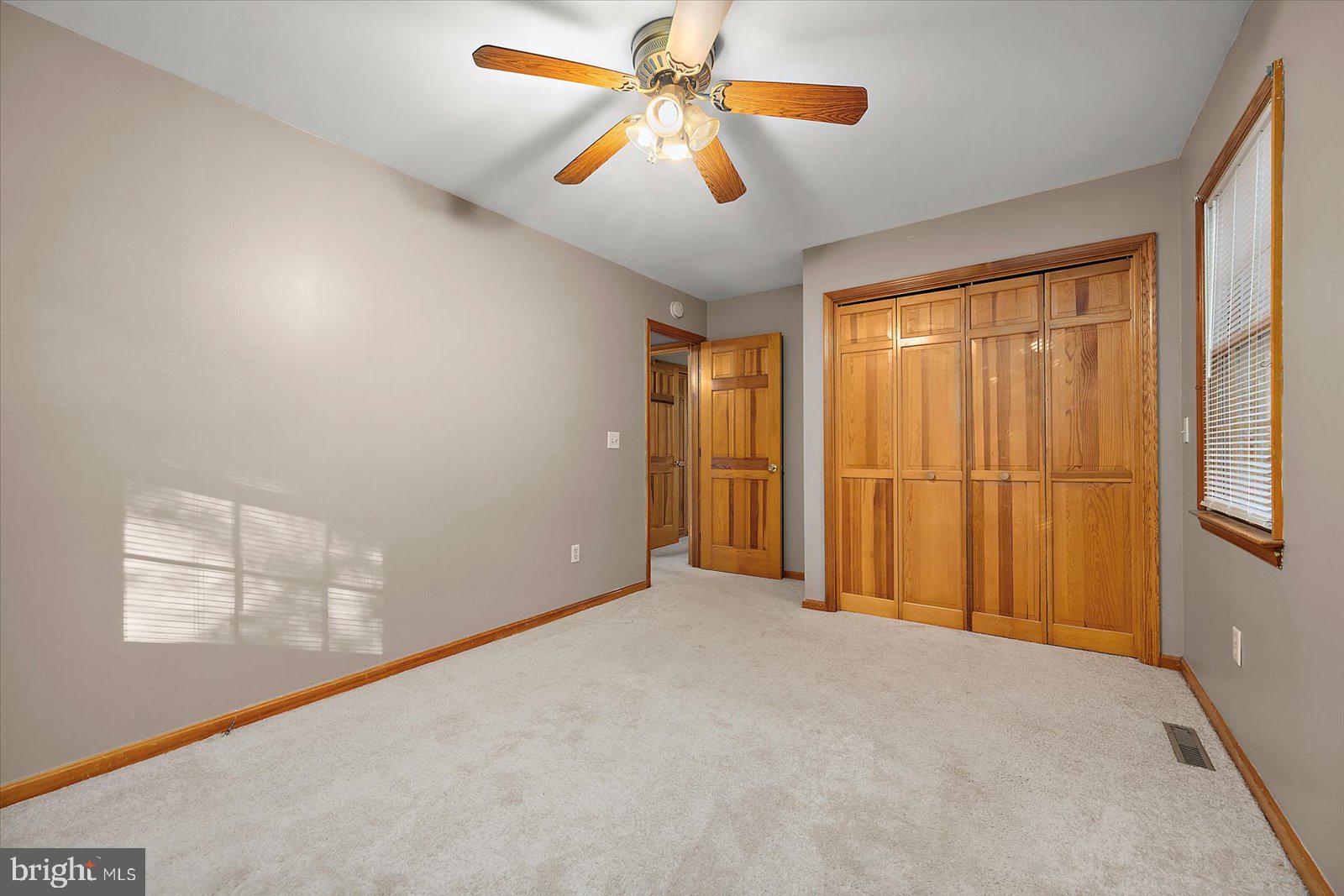 5079 Old Mill Branch Road Salisbury, MD 21801 - Photo 27 of 47 a view of an empty room with a window