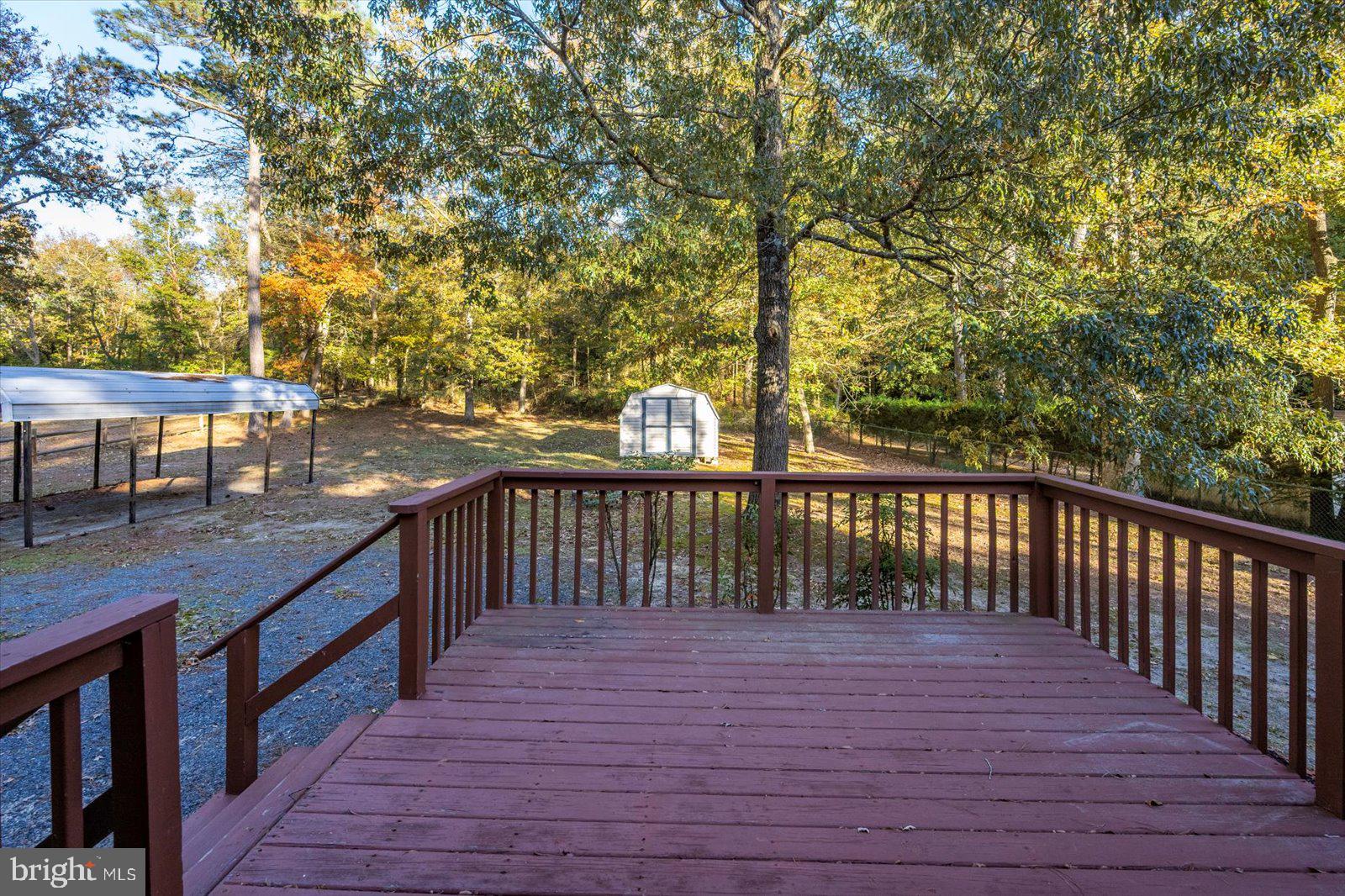 5079 Old Mill Branch Road Salisbury, MD 21801 - Photo 31 of 47 a balcony with wooden floor and outdoor space