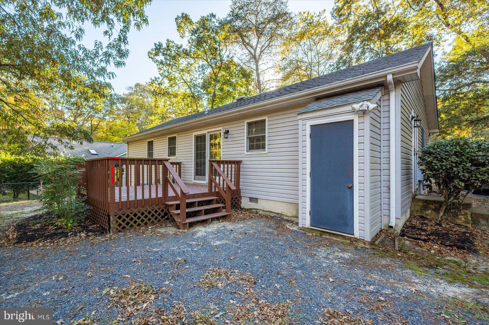 5079 Old Mill Branch Road Salisbury, MD 21801 - Photo 36 of 47 a view of a house with a yard and wooden fence