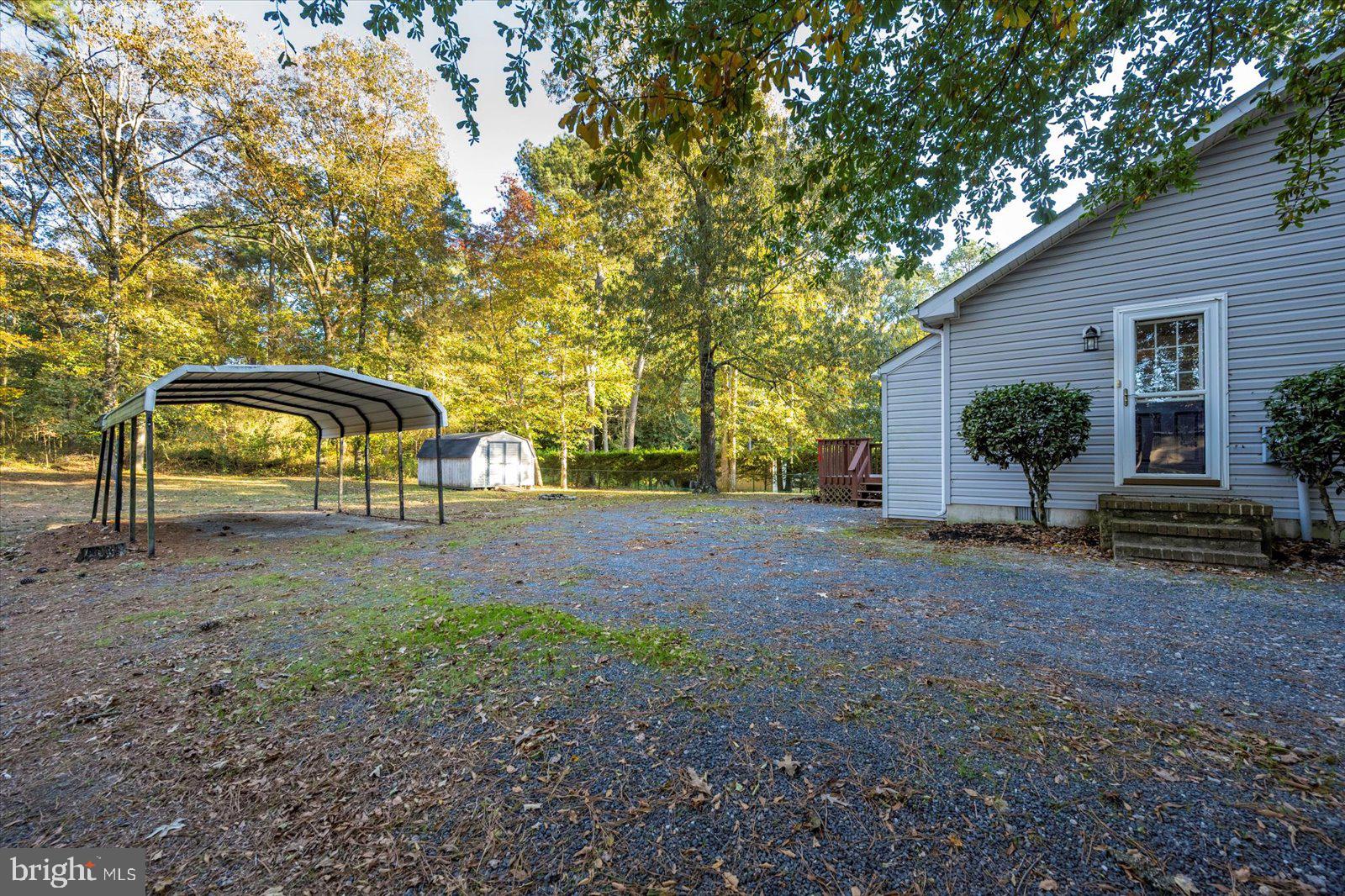 5079 Old Mill Branch Road Salisbury, MD 21801 - Photo 42 of 47 a view of a house with large trees and plants