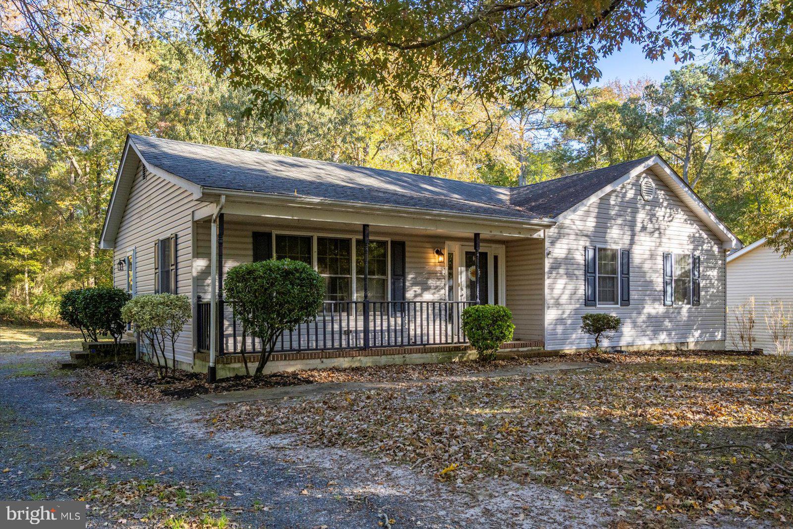 5079 Old Mill Branch Road Salisbury, MD 21801 - Photo 46 of 47 a front view of a house with garden