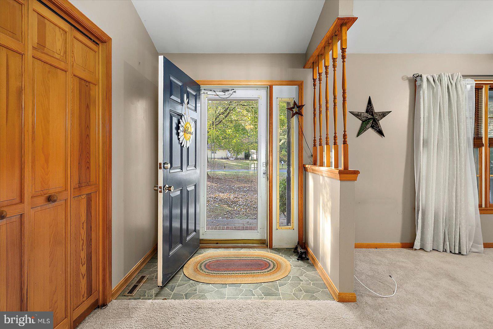 5079 Old Mill Branch Road Salisbury, MD 21801 - Photo 5 of 47 a view of a bathroom with a tub shower and checkered walls