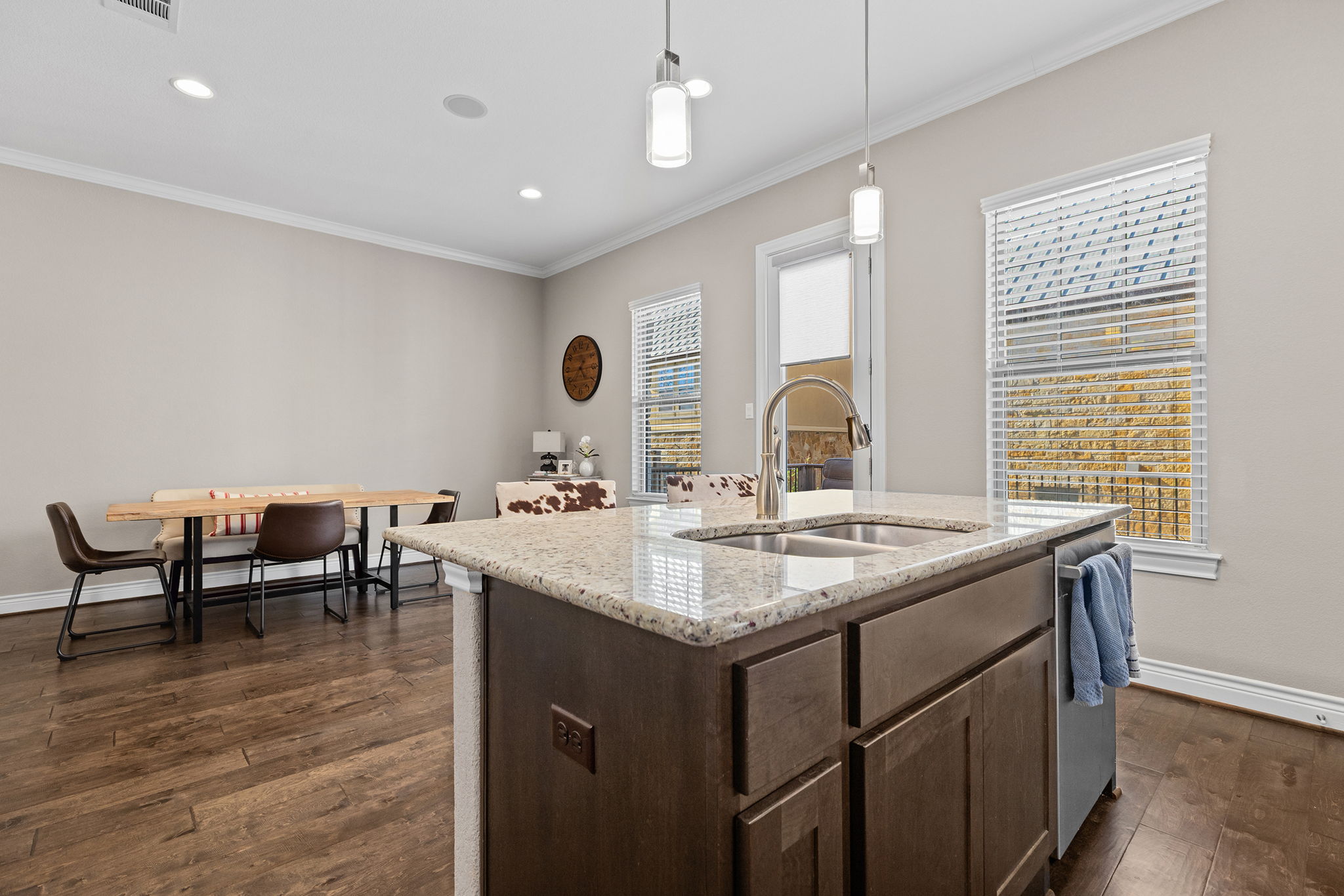 1125 Highknoll Lane Georgetown, TX 78628 - Photo 7 of 40 a kitchen with a sink and chairs