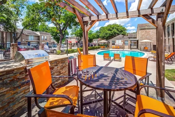 a view of a chairs and table in the patio