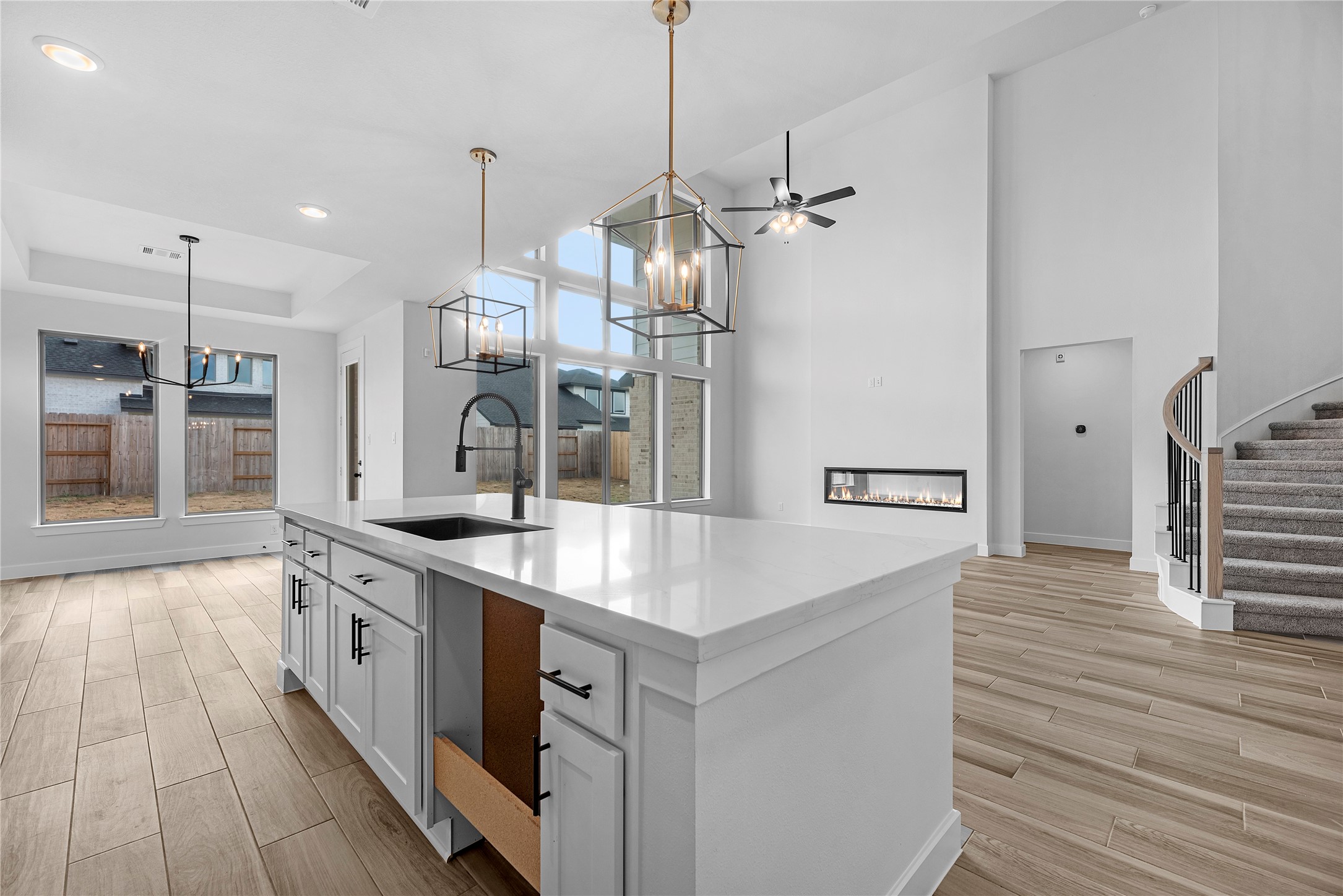 615 Roland Lane Rosenberg, TX 77471 - Photo 7 of 26 a kitchen with stainless steel appliances granite countertop a sink a oven a refrigerator and a wooden floor