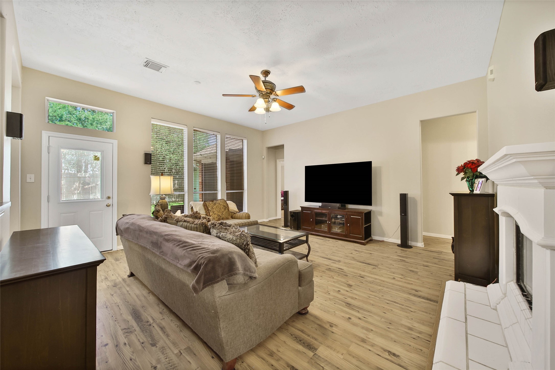 21338 Timber Pines Drive Spring, TX 77388 - Photo 9 of 29 a living room with furniture fireplace and a flat screen tv