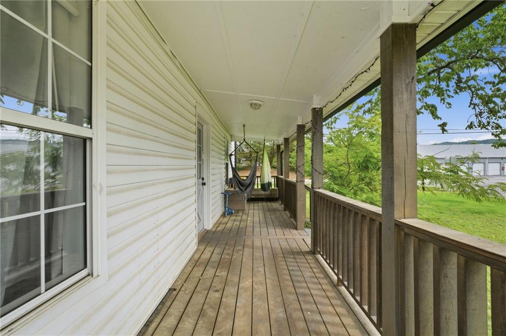 400 Sam Love Road Rocky Face, GA 30740 - Photo 4 of 29 a view of a balcony with wooden floor