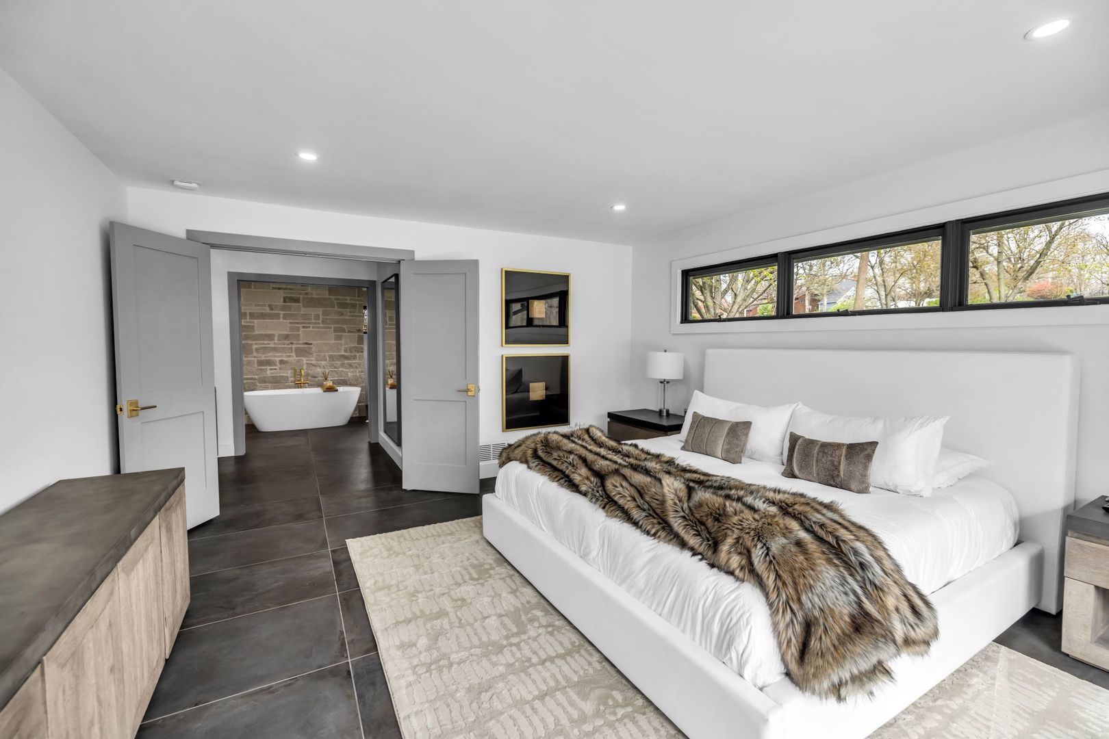 65 South Shores Drive Decatur, IL 62521 - Photo 12 of 25 a bedroom with a large bed and a couch