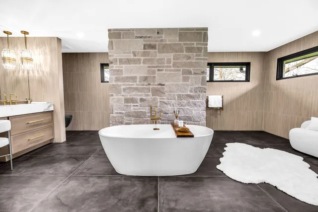 a spacious bathroom with a bathtub and shower