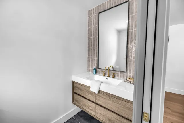 a bathroom with a sink and a mirror