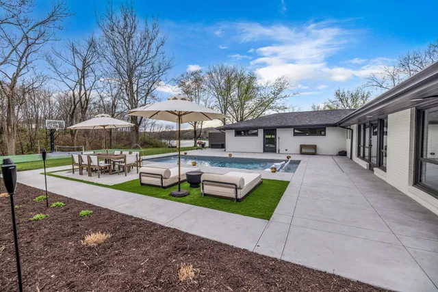 a view of a house with a yard patio and slide
