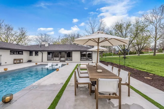 an outdoor space with furniture and umbrella