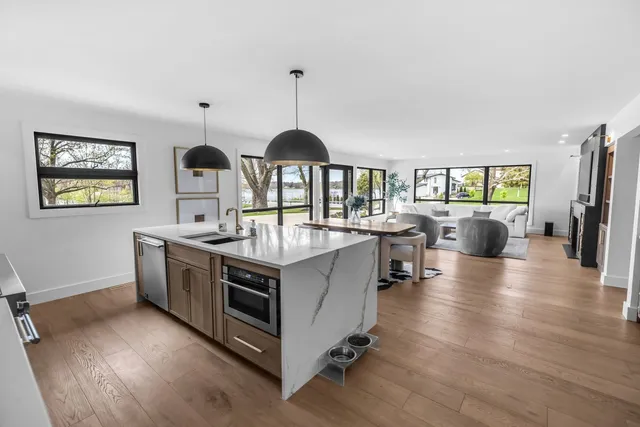 a kitchen with stainless steel appliances granite countertop a stove and a sink
