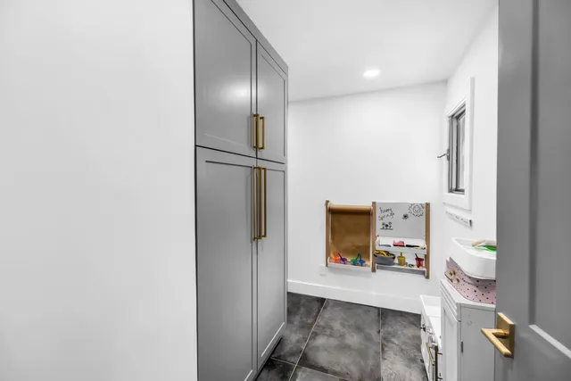 a view of a hallway with seating area