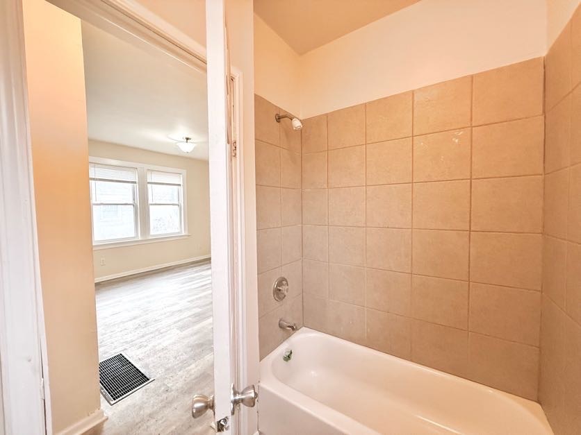 1406 West 109th Place Chicago, IL 60643 - Photo 14 of 23 a bathroom with a bathtub and shower