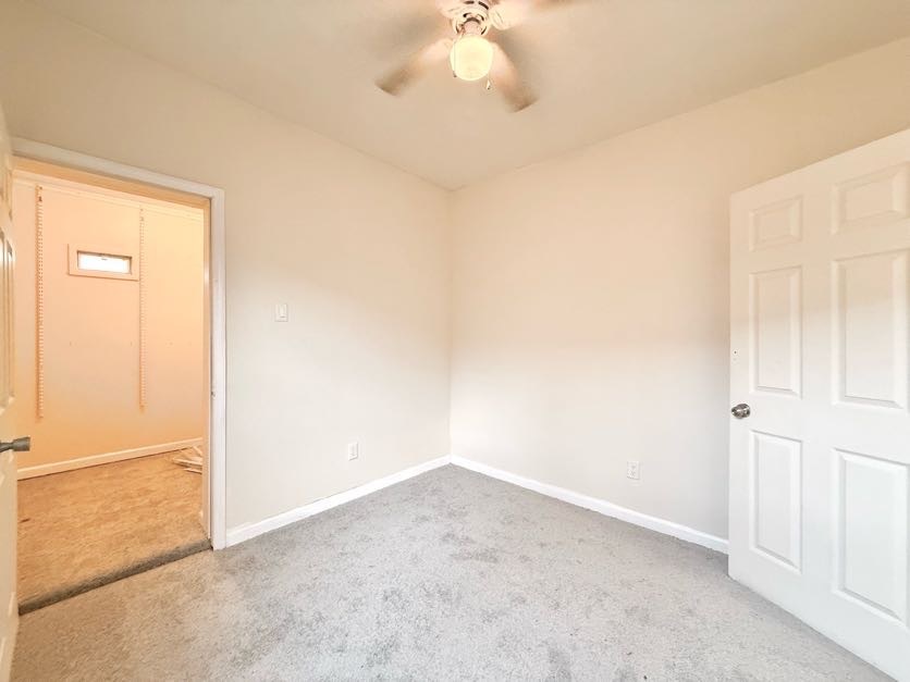 1406 West 109th Place Chicago, IL 60643 - Photo 15 of 23 an empty room with a chandelier fan