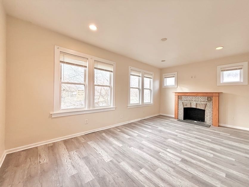 1406 West 109th Place Chicago, IL 60643 - Photo 3 of 23 a view of an empty room with a window and fireplace