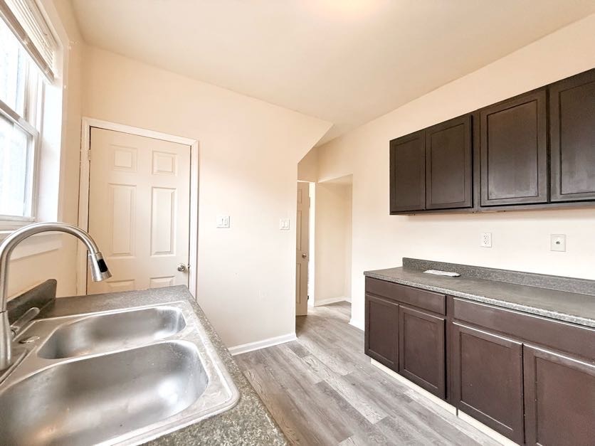 1406 West 109th Place Chicago, IL 60643 - Photo 7 of 23 a kitchen with a sink and a microwave