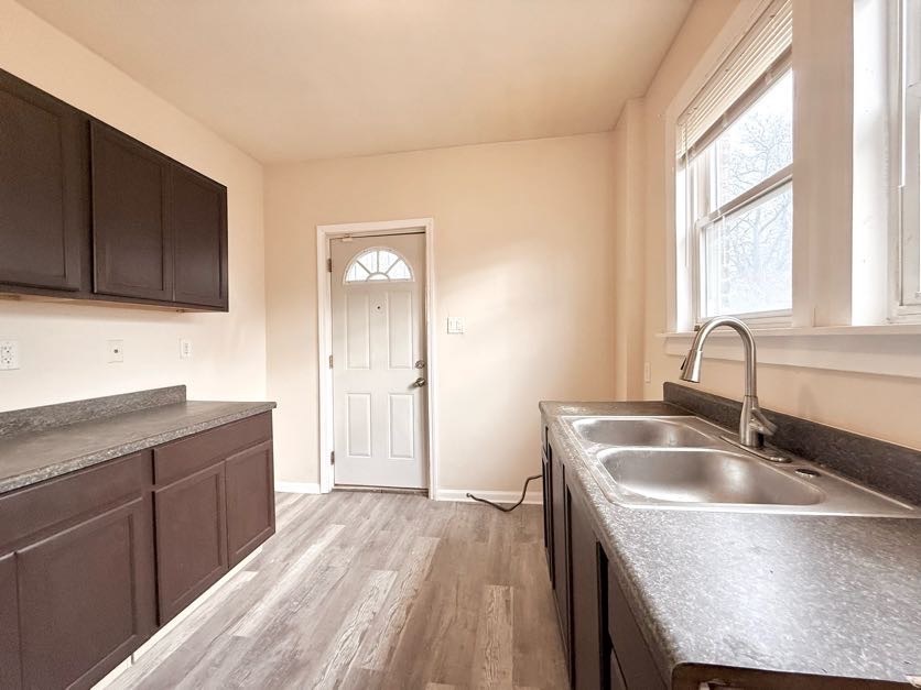 1406 West 109th Place Chicago, IL 60643 - Photo 8 of 23 a kitchen with a sink cabinets and window