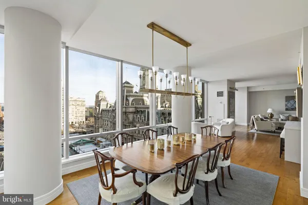 a view of a dining room with furniture window and wooden floor