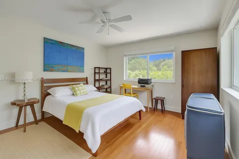 a bedroom with a bed and a table in it