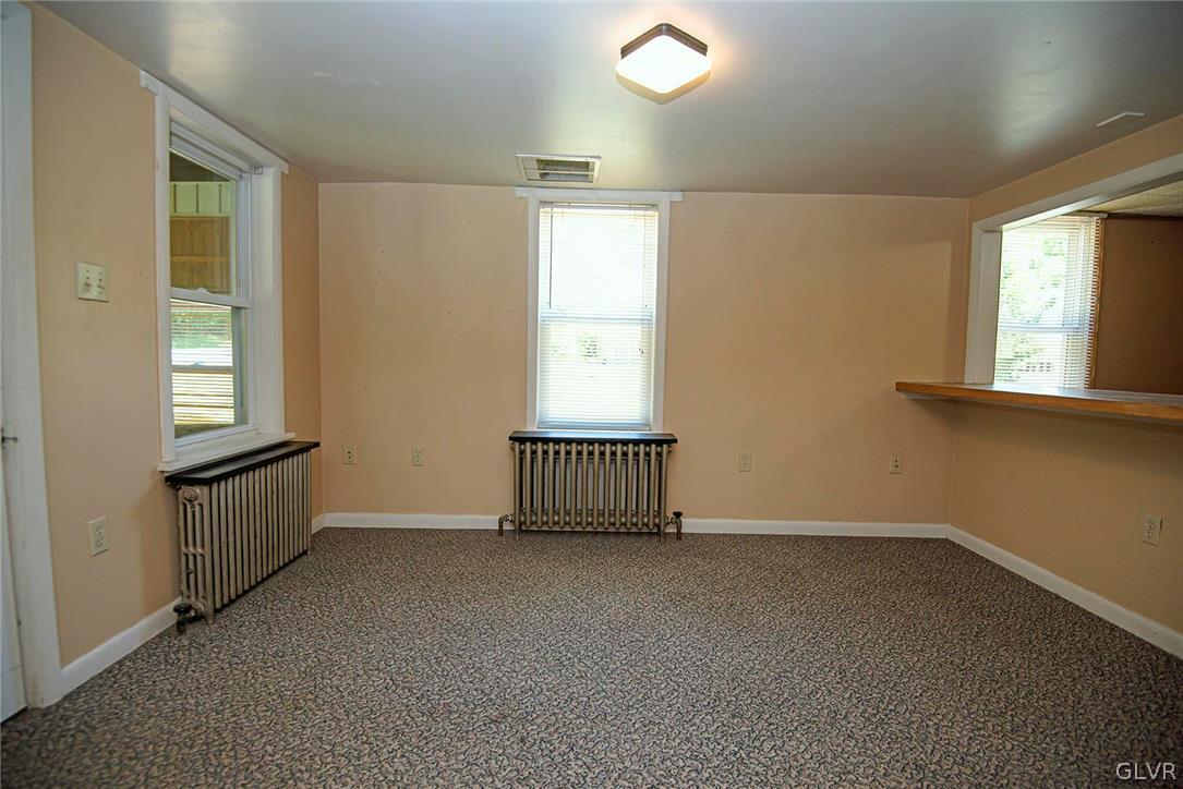 519 Shooktown Road Bangor, PA 18013 - Photo 18 of 35 an empty room with a window and fireplace
