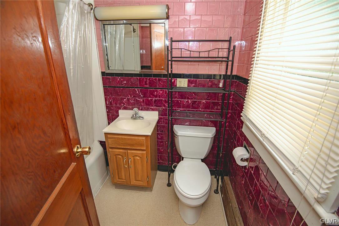 519 Shooktown Road Bangor, PA 18013 - Photo 34 of 35 a bathroom with a toilet a sink and mirror