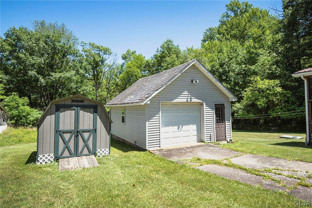 519 Shooktown Road Bangor, PA 18013 - Photo 4 of 35 a front view of a house with a yard and garage