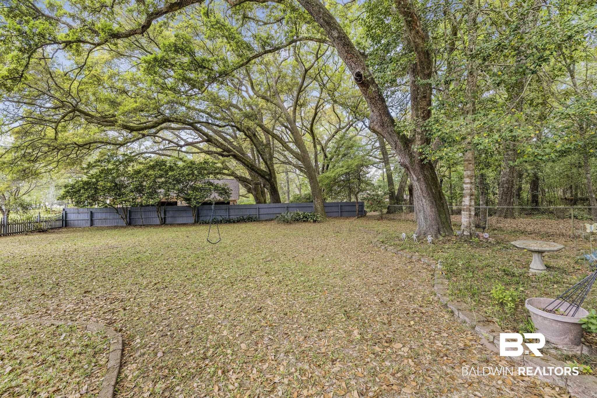10207 Plantation Drive Daphne, AL 36526 - Photo 11 of 48 View of fenced backyard